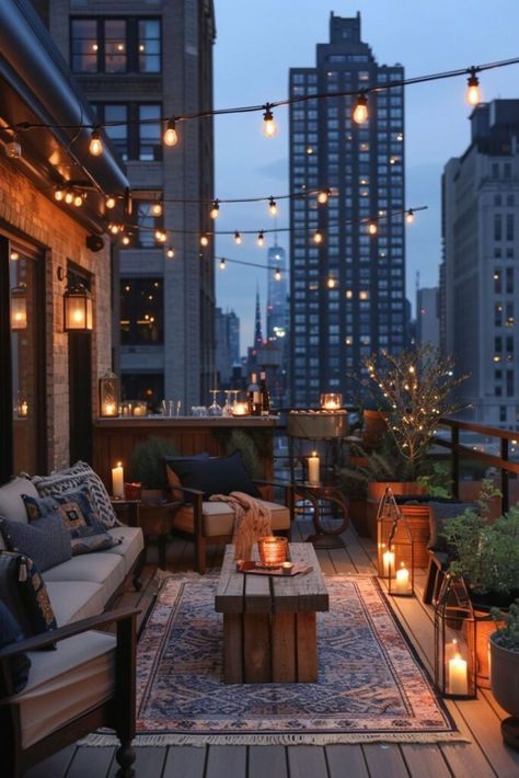 an outdoor patio with lights strung from the ceiling and potted plants on the deck