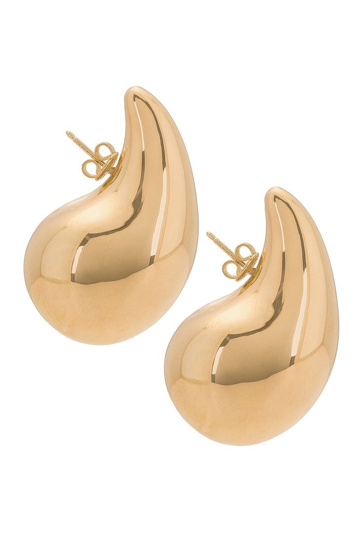 Find BOTTEGA VENETA Drop Earrings In Metallic on Editorialist. Bottega Veneta Drop Earrings in Metallic Gold 18k gold-plated silver. Made in Italy. Post-back fastening for pierced ears. Measures approx 1 W x 2 H. BOTT-WL68. 720038-VAHU0-8120. About the designer: Bottega Veneta – inspiring individuality with innovative craftmanship since 1966. Creativity lies at the heart of all that we do. Born in Vicenza the house is rooted in Italian culture yet maintains a truly global outlook. An inclusive brand with exclusive products Bottega Veneta is as much of a feeling as it is an aesthetic. Gold Earrings With Shiny Finish In Fine Jewelry Style, Gold Earrings With Shiny Finish, Luxury Teardrop Tarnish Resistant Earrings, Luxury Tarnish-resistant Teardrop Earrings, Luxury Single Pear-shaped Earring, Luxury Gold Teardrop Earrings For Formal Occasions, Gold Pear-shaped Earrings For Pierced Ears, Luxury Gold Teardrop Hoop Earrings, Gold Pear-shaped Teardrop Earrings In Sterling Silver