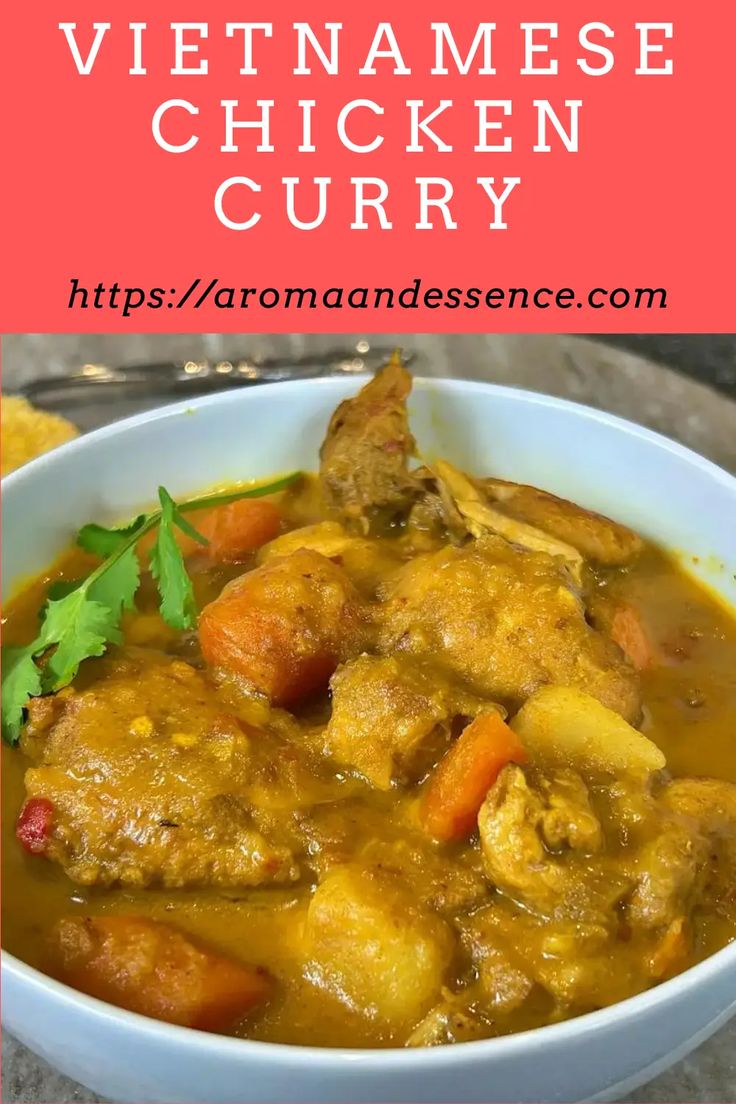 a white bowl filled with chicken curry and garnished with cilantro