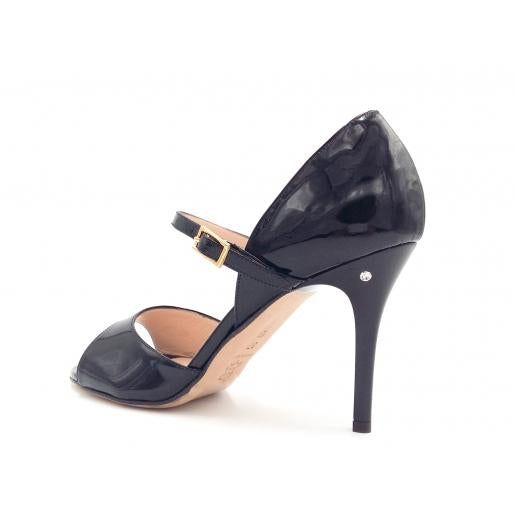 There is nothing shy about this shoe: In a deep black patent leather, It has a high drama back with a low ankle strap and a single toe band. The silhouette is striking and demands attention. Equally at home on the red carpet or a dance floor, Gloria will not disappoint. The shoe is finished with a subtle signature brilliant adornment on the left heel. With a soft memory foam foot bed padding, you are comfortable from the very first wear. Patent leather Open toe Closed heel Leather lining Leather Sleek Evening Patent Leather Sandals, Evening Dance Shoes With 4-inch Heel, Elegant Leather Dance Shoes With 4-inch Heel, Elegant Fitted Dance Shoes With 4-inch Heel, Party Dance Shoes With Heel And Ankle Straps, Night Out Patent Leather Sandals With Sculpted Heel, Evening Dance Shoes With 4-inch Heel And Ankle Strap, Fitted Pointed Toe Evening Dance Shoes, Elegant Patent Leather Sandals With Sculpted Heel