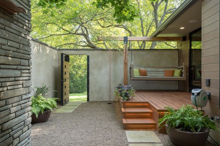 an outdoor patio with steps leading to the bedroom