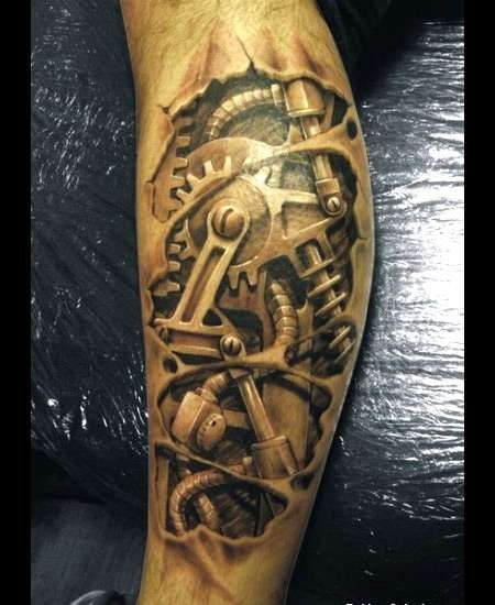 a man's arm with a clock and gears tattoo on the forearm, which is made out of wood