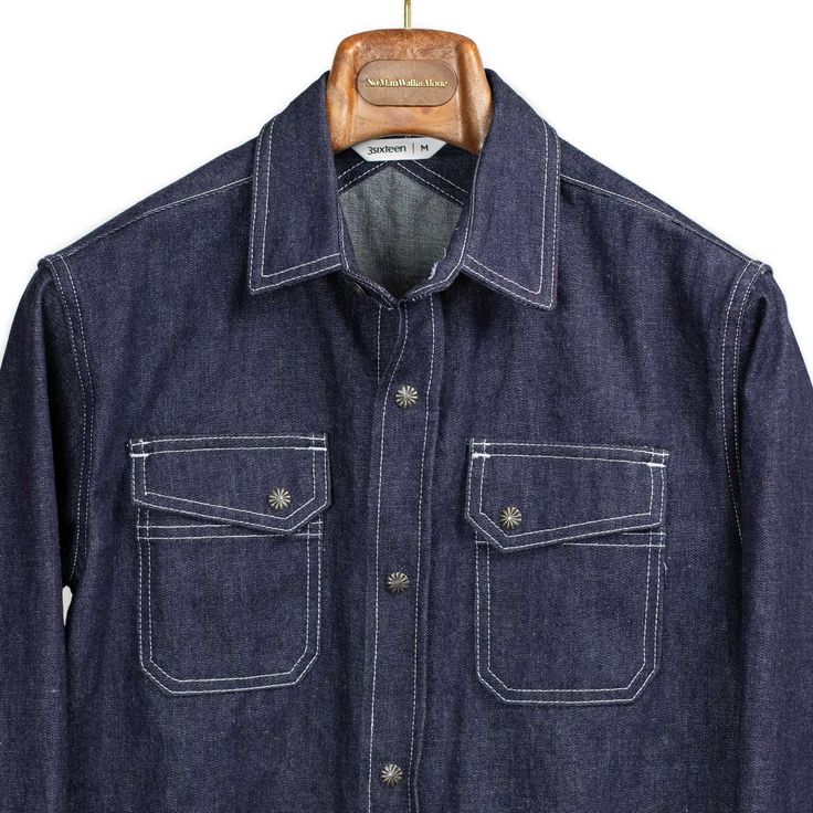 "The classic 3sixteen crosscut shirt makes it's return this season in a rinsed 10oz denim, a little heavier than your typical denim shirt and better details, be it the contrast stitching or the custom gunmetal starburst snaps. It's all the little things make a good shirt and the 3sixteen team has the eye for them."---Kenshawn Details 100% cotton Two chest pockets, curved hem, selvedge edge inside shirt placket Crosscut yoke, custom gunmetal starbust snaps Made in USA Size & Fit Slim fit We recom Pose Poto, Blue Denim Western Shirt, Shirt Placket, Western Denim Shirt Men, Unstructured Indigo Denim Shirt, Denim Western Shirt, Mechanics Jacket, Vintage Denim Workwear Shirt, Denim Projects