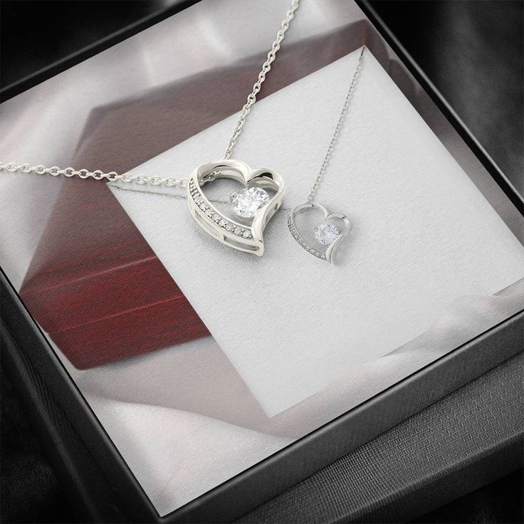 Give a loving gift that will make her heart melt! This dazzling Forever Love Necklace features a polished heart pendant surrounding a flawless 6.5mm cubic zirconia, embellished with smaller crystals adding extra sparkle and shine. The pendant is crafted in 14K white gold finish and dangles from an adjustable cable chain secured with a lobster clasp. DIMENSIONS: ▶ 14K white gold finish ▶ Adjustable cable chain 18" - 22" ▶ 6.5mm round cut cubic zirconia ▶ Height 0.8" (2.2cm) Width 0.7" (1.8cm) PERFECT FOR: Birthday Gift, Thanksgiving Day Gift, Christmas Gift, New Years Gift, Best Friend Gift, Family Gift, Valentines Day Gift, Mother Necklace, Daughter Necklace, Promise Necklace, Daily-wear Necklace. Promise Necklace, Loving Gifts, Wear Necklaces, Daughter Necklace, Mothers Necklace, Heart Melting, Forever Love, Love Necklace, New Year Gifts