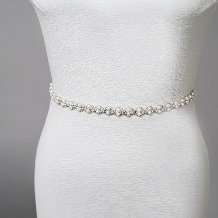 Embroidered pearl and rhinestone sash. Best Seller! Measurements: Embroidery length 30"Height: 1"Ribbon length 80" Elegant Beaded Bridal Belt, Elegant Beaded Fitted Bridal Belt, Elegant White Belt With Rhinestones, Elegant White Sashes With Rhinestones, Formal Fitted Sash With Rhinestones, White Embellished Fitted Sash, Elegant Embellished Fitted Sash, Elegant Embellished Fitted Sashes, Elegant Fitted Embellished Sashes