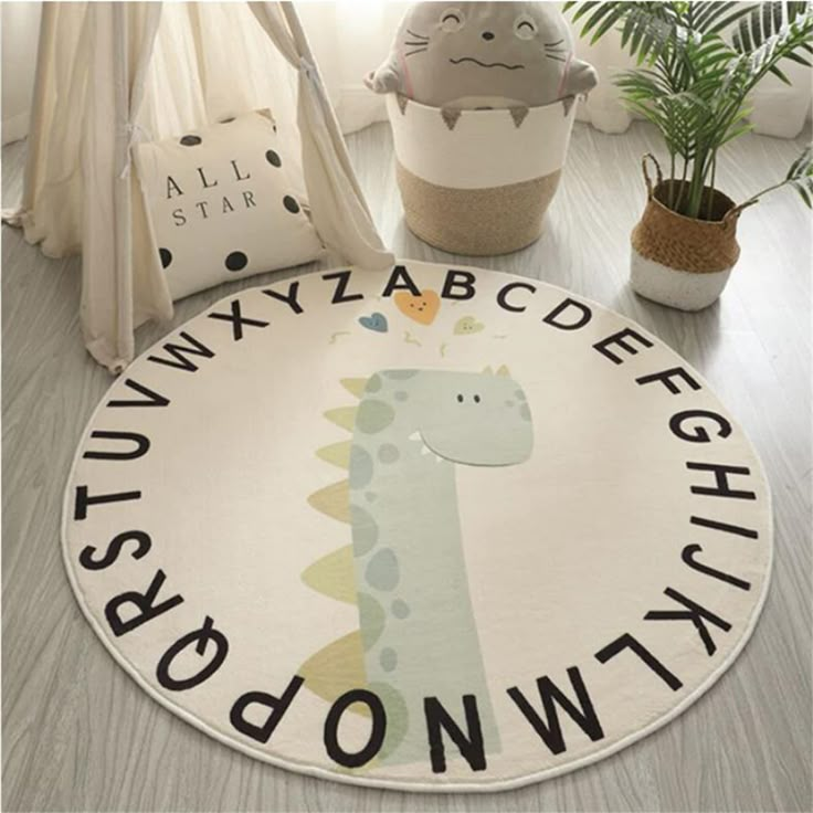 PRICES MAY VARY. ABC round rug is made of high-quality cashmere polyester fiber, the dense and thick pile makes your feet feel comfortable and soft. The area rug has a non-slip latex backing at the bottom, Better protect your baby from injury while playing. 26 letter patterns develop your baby's understanding of basic learning letters, allowing you to get closer to your daily life with your child. This alphabet rug is available in five sizes, 31"/39"/47"/63"/78". folding package,recommended to u Boy Nursery Dinosaur, Baby Boy Nursery Dinosaur, Dino Alphabet, Alphabet Rug, Nursery Dinosaur, Dino Nursery, Dino Room, Baby Boys Nursery, Dinosaur Nursery Decor