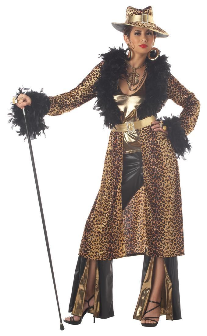 a woman dressed in leopard print and black feathers, holding a cane with her hands