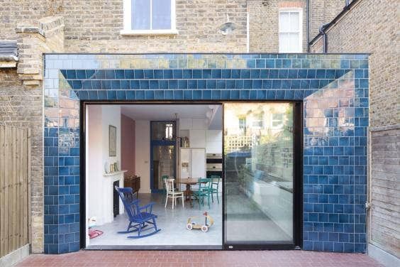 a screen shot of the inside of a house with blue tiles on the walls and doors