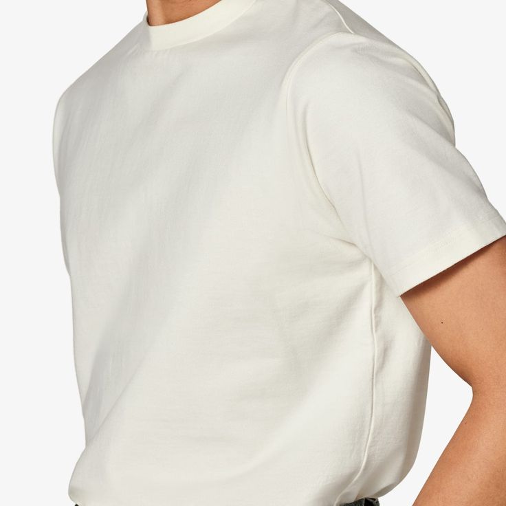 This off-white crewneck T-shirt boasts a "straight" fit that lends a modern aesthetic to your style. Sport it as a base layer or roll up the sleeves & keep it classic with jeans or shorts. Basic Cream T-shirt For Everyday, Off White Cotton Crew Neck Top, Classic Spring Crew Neck T-shirt, White Short Sleeve T-shirt For Casual Gatherings, White Crew Neck Top For Casual Gatherings, White Classic Top With Straight Hem, Urban Crew Neck Top For Everyday, Off White Relaxed Fit Crew Neck Tops, Modern White T-shirt For Everyday