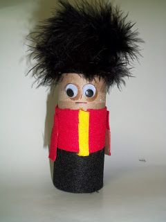 a wooden nutcracker with big eyes and black hair on it's head