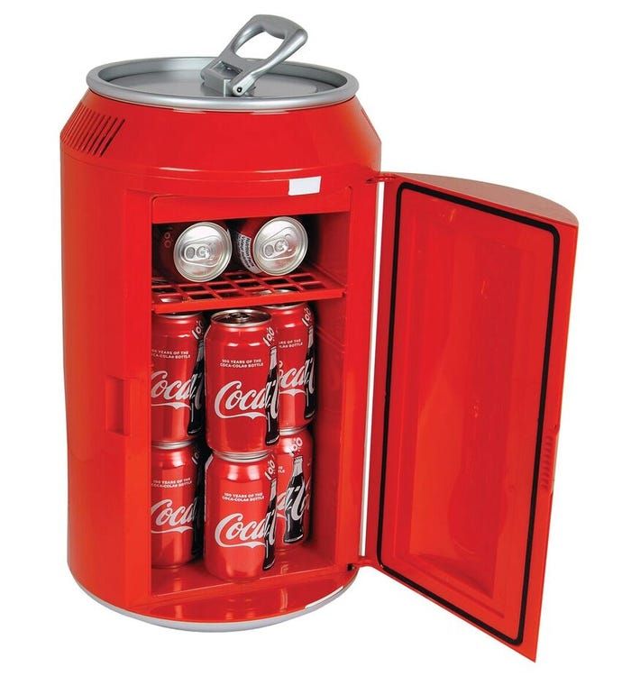 an open coca - cola cooler with six cans in it