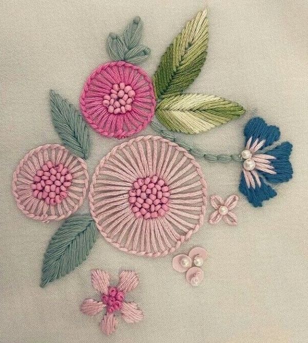 some pink and blue flowers on a white cloth