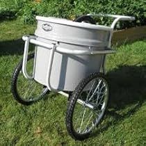 a white cooler sitting on top of a grass covered field