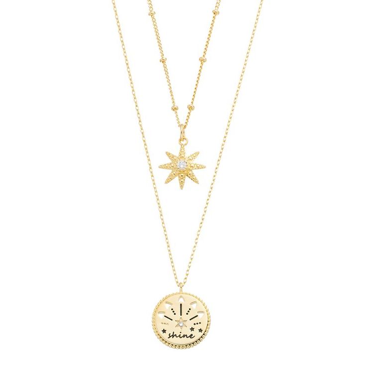 Add a little celestial interest to your jewelry collection with this set of two 14k gold-plated City Luxe necklaces, one a starburst with a sparkly cubic zirconia stone in the center and the other a medallion with a petite cubic zirconia accent, emblazoned with the word "shine". SET DETAILS Includes: two necklaces Pendant length: 0.62 in. Chain length: 16 in. + 2 in. extender Chain type: bead, cable Metal: brass Plating: 14k gold Finish: polished Packaging: boxedSTONE DETAILS Stone type: cubic z Celestial Jewelry With Starburst Star Charm, 14k Gold Starburst Celestial Jewelry, Gold Starburst Jewelry With Star Charm, Dainty Starburst Yellow Gold Jewelry, Tarnish Resistant Gold Plated Star Jewelry, Gold Celestial Jewelry With Star Charm, Celestial Star Jewelry With Delicate Chain, Celestial Gold Plated Jewelry With Star Charm, Gold Plated Jewelry With Star Charm