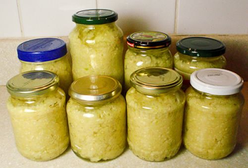 several jars filled with food sitting on top of a counter