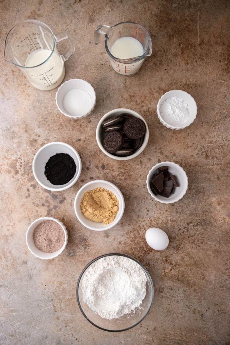 the ingredients for cookies are in bowls on the table