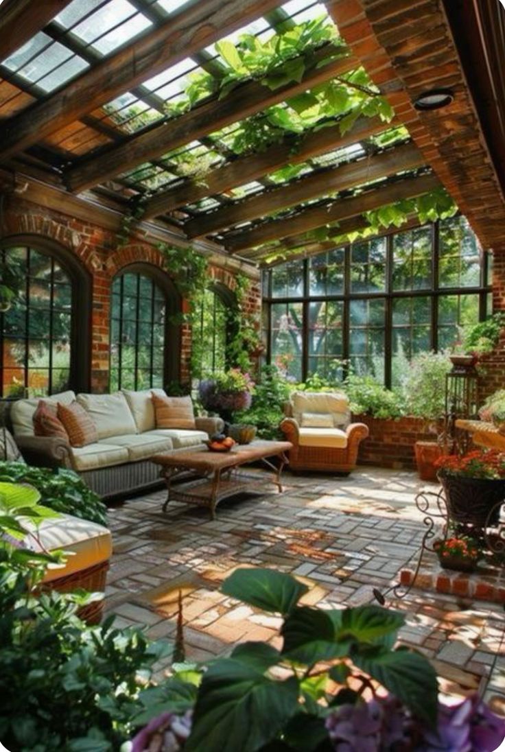 an outdoor living room with lots of plants