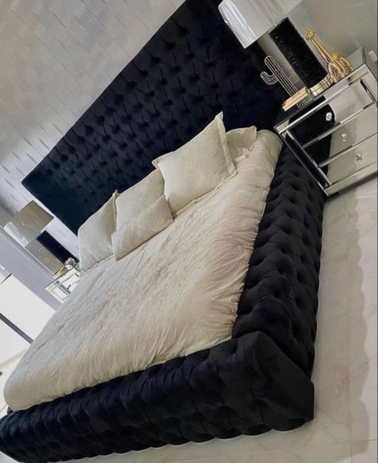 a black and white bed in a room