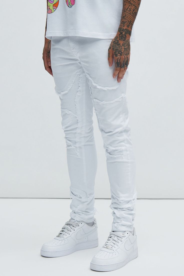 Available In White. Stacked Skinny Fit Stretch Denim Zip Fly Button Closure 5 Pocket Body Fray With Patch Detail Disclaimer: Patch Placement May Vary 98% Cotton 2% Spandex Imported | Mens Got Your Back Patched Stacked Skinny Jeans in White size 40 by Fashion Nova Ripped Fitted Cotton Jeans, Fitted Ripped Cotton Jeans, White Distressed Fitted Jeans, White Distressed Bottoms For Streetwear, White Washed Bottoms For Streetwear, Stretch Distressed White Bottoms, Fitted Distressed White Bottoms, Slim Fit White Denim Bottoms, White Slim Fit Denim Bottoms