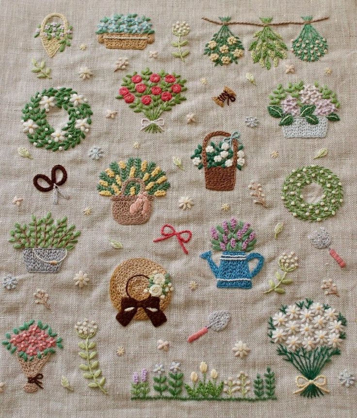 a close up of a piece of cloth with flowers and potted plants on it