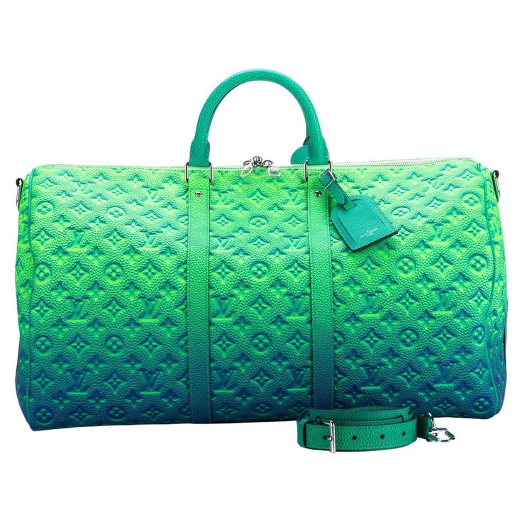 The Louis Vuitton Keepall 50 Bandouliere is made from bull calfskin with a soft multicolored green. This bag is from the Virgil Abloh Illusion leather collection. Soft side and cabin-friendly, the Keepall 50 bag merits it’s name: the unexpectedly spacious interior can hold everything needed for a weekend gateway. This is the new and the last collection of the late designer Virgil Abloh. Chanel Black Flats, Luxury Luggage Sets, Louis Vuitton Watercolor, Louis Vuitton Duffle Bag, Louis Vuitton Keepall 50, Leather Duffel Bag, Louis Vuitton Limited Edition, Leather Weekender Bag, Diy Clothes And Shoes