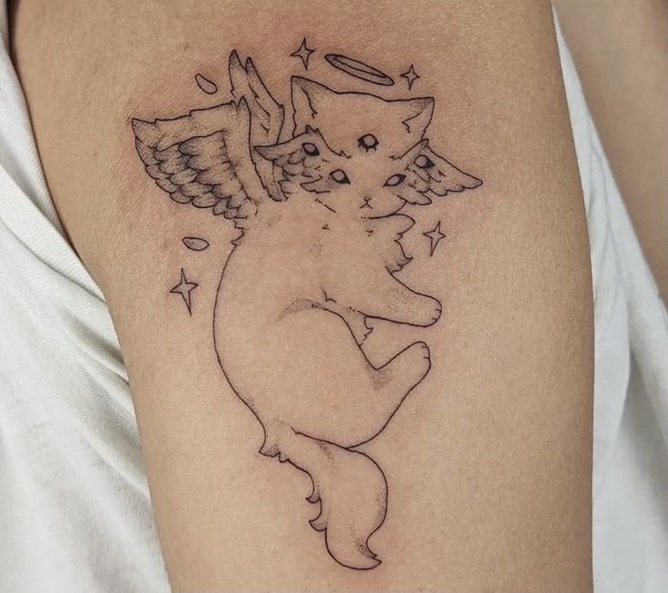 a cat with angel wings on it's back is shown in this tattoo design