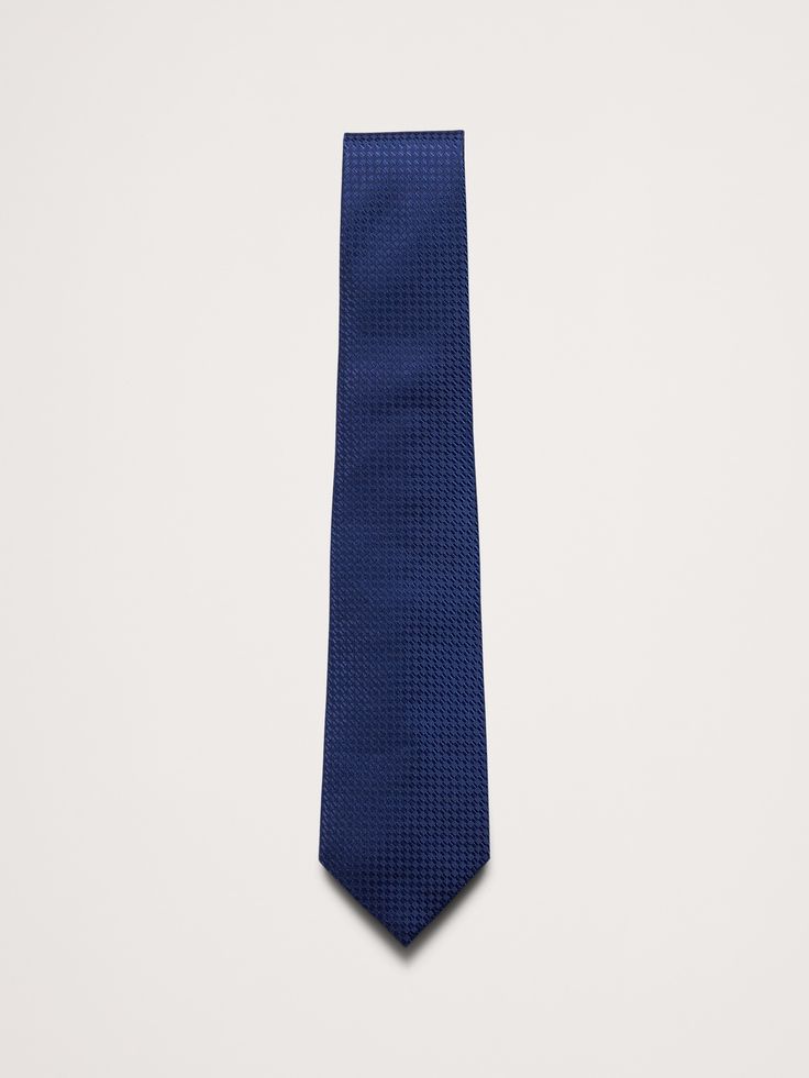 The perfect finishing touch, this tie is made from soft and smooth silk.  Measures 3" at widest point.  Length: 58" (147cm) Max width: 3" Blue Silk Suit And Tie Accessories For Work, Blue Silk Suit And Tie Accessories For Office, Elegant Blue Neckwear For Business, Blue Silk Ties For Work, Blue Silk Tie For Workwear, Blue Silk Ties For Business, Blue Silk Tie For Black Tie Events, Blue Tailored Ties For Business, Tailored Blue Formal Tie