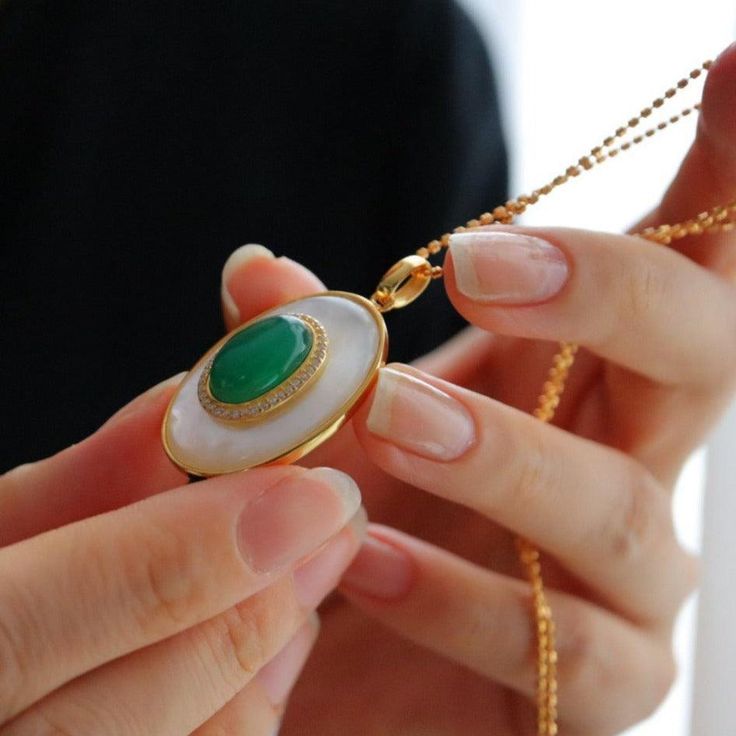 Green Onyx Mother of Pearls Pendant Necklace Gold Vermeil #pearls #tahitianpearls #culturedpearls #classicpearls #Akoyapearls #pearlstrand #luxuryjewelry #SouthSeaPearls #goldensouthseapearls #PearlJewellery Luxury Oval Jade Necklaces, Elegant Jade Cabochon Necklace, Luxury Jade Necklace For Gift, Oval Jade Cabochon Necklaces, Oval Jade Cabochon Necklace, Oval Jade Necklaces With Hallmark, Hallmarked Oval Jade Necklaces, Luxury Jade Pendant Jewelry, Round Jade Cabochon Necklace