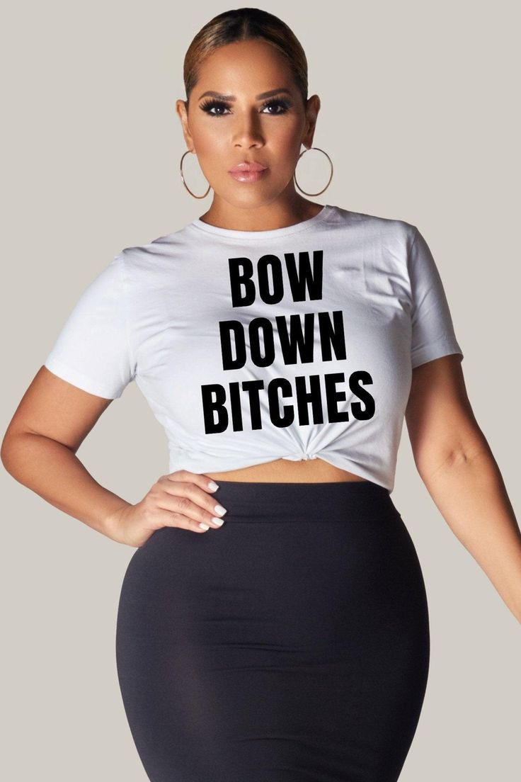 Looking for a bold and empowering statement piece for your wardrobe? Look no further than the "Bow Down Bitches" t-shirt! Made with high-quality soft cotton, this tee feels comfortable and cozy from the very first wear. The ribbed knit collar provides added structure and shape, while the taped shoulders ensure a great fit that lasts wash after wash. This versatile t-shirt is perfect for any casual occasion, from running errands to meeting up with friends. Dress it up with a skirt and heels for a Trendy Stretch T-shirt With Slogan, Edgy Short Sleeve T-shirt With Funny Print, Edgy Fitted Slogan T-shirt, Edgy Fitted T-shirt With Slogan, Funny Quote Print Crew Neck Top, Trendy Cropped Crew Neck T-shirt With Funny Text, Graphic Tee Cropped T-shirt For Streetwear, Stretch Graphic Tee Cropped T-shirt For Streetwear, Graphic Cropped T-shirt For Streetwear With Stretch