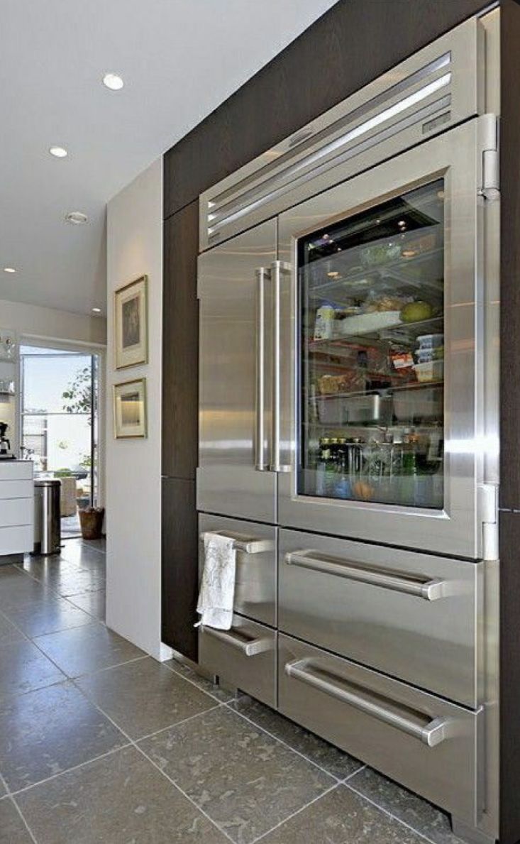 a large stainless steel refrigerator in a kitchen