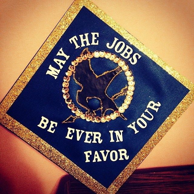 a blue and gold graduation cap that says, may the jobs be ever in your favors