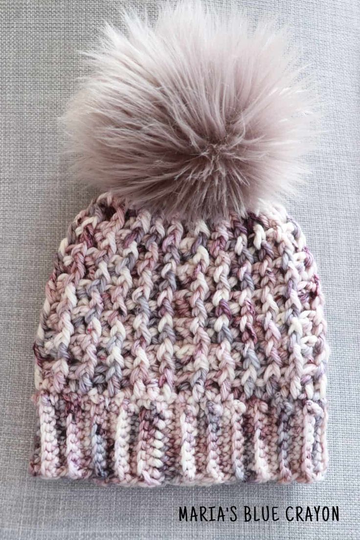 a knitted hat with a pom - pom on top