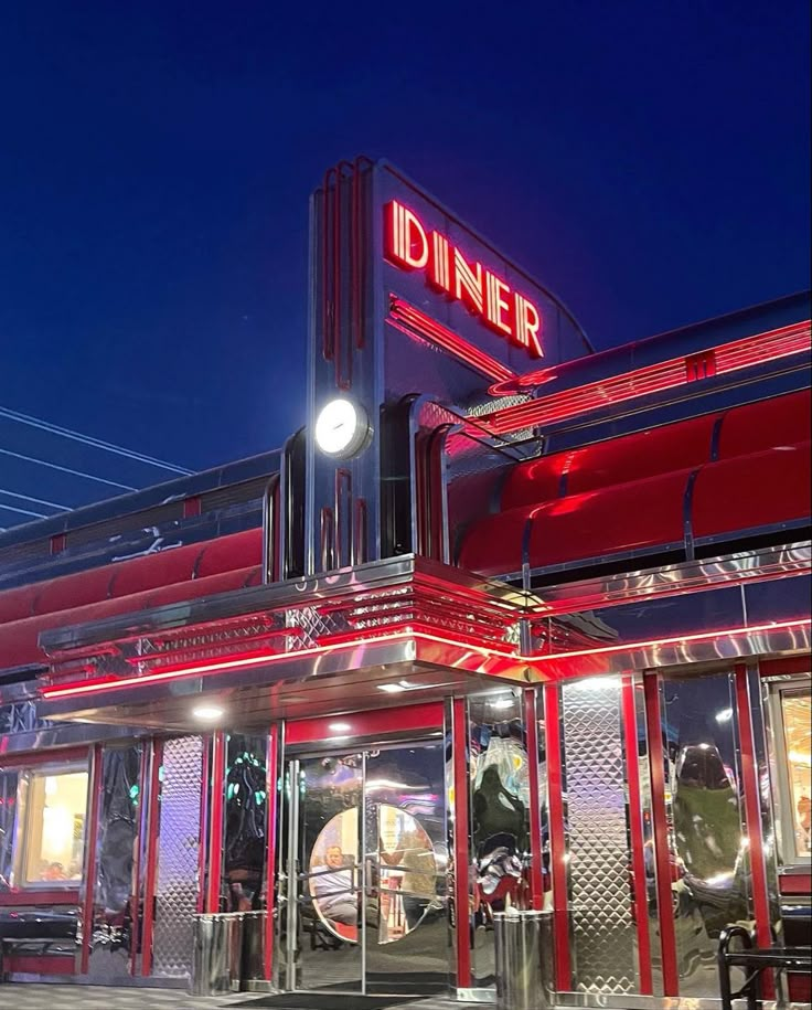 the diner is lit up at night time