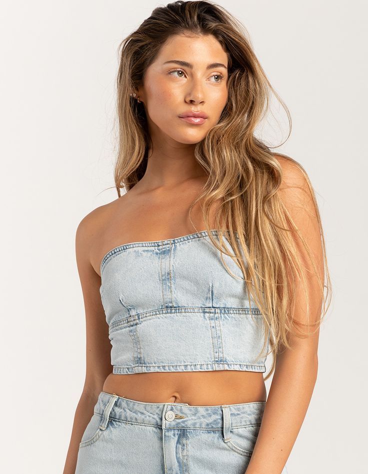 Rsq Denim Tube Top. Crafted From Soft And Durable Denim Fabric, This Tube Top Offers Both Comfort And Style. The Strapless Design Provides A Sleek And Flattering Silhouette, Perfect For Warm Weather Days Or Layering Under Jackets And Cardigans. Zipper Closure At Back. Cropped Fit. 100% Cotton. Machine Wash. Imported. Model Is Wearing A Size Medium. Model Measurements:height: 5'7" Bust: 34.5"waist: 27"hips: 38" Denim Blue Strapless Crop Top For Spring, Strapless Denim Blue Crop Top For Spring, Summer Light Wash Strapless Denim Top, Strapless Denim Crop Top For Spring, Spring Strapless Denim Crop Top, Strapless Light Wash Denim Top, Summer Strapless Denim Blue Vest, Dark Wash Denim Tube Top For Summer, Summer Medium Wash Denim Tube Top