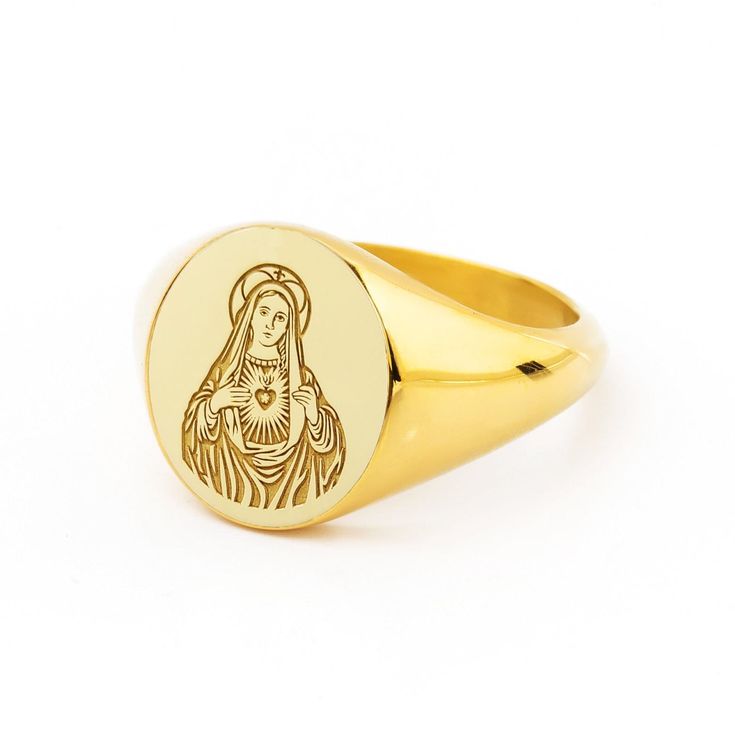 A beautiful Virgin Mary design engraved in our best-seller signet rings! *real images of the ring, taken by us* Face Size: 13x11mm Material: - Sterling Silver (925) - 9K Gold (375) - 14K Gold (585) - 18K Gold (750) *All signet rings are hallmarked on the back for certification* - We offer FREE Worldwide DHL & FedEx Shipping! - Branded DanelianJewelry Gift Box with each order! Our customer service is available 7 days a week. Leave us your message, and we will get back to you within a little time. Engraved Oval Signet Ring For Commemoration, Engraved Signet Ring For Commemoration, Gold Engraved Signet Ring For Commemoration, Spiritual Oval Engraved Ring, Round Engraved Ring For Commemoration, Spiritual Gift Signet Ring With Polished Finish, Symbolic Engraved Signet Ring Gift, Oval Spiritual Engraved Ring For Anniversary, Oval Etched Signet Ring As Gift