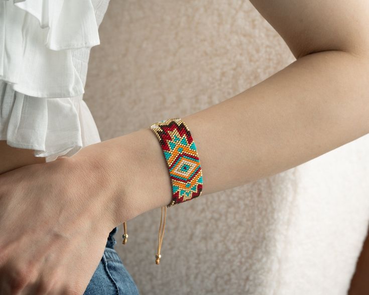 💎 A lovely boho style native american design aztec bracelet.. ❤️ One of kind, beaded bracelet in orange, turquoise blue, red and black is designed to add beauty to your beauty.. ⭐ This tribal western bracelet, with elegant flowing texture in boho is a new design must-have! It is uniquely as navajo soul of a mayan bracelet designed for you.Show your love and appreciation for the beautiful souls in your life with this navajo bracelet that are sure to make them feel special.Add a touch of boho chi Bohemian Beaded Bracelets For Friendship With Adjustable Length, Beaded Bohemian Friendship Bracelet, Bohemian Friendship Bracelets For Festivals, Bohemian Resizable Bangle Bracelets, Bohemian Festival Jewelry With Bracelet Strap, Bohemian Round Beads Friendship Bracelets For Festivals, Southwestern Festival Beaded Bracelets, Bohemian Multicolor Bracelet Strap Jewelry, Bohemian Bangle Friendship Bracelets