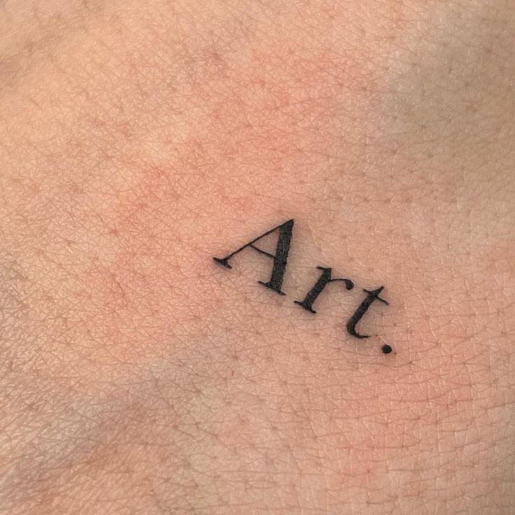 the word art is written in small black ink on the left side of the arm