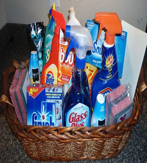 a basket filled with lots of different types of cleaning products on top of a counter