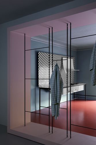 an open room with clothes hanging in it