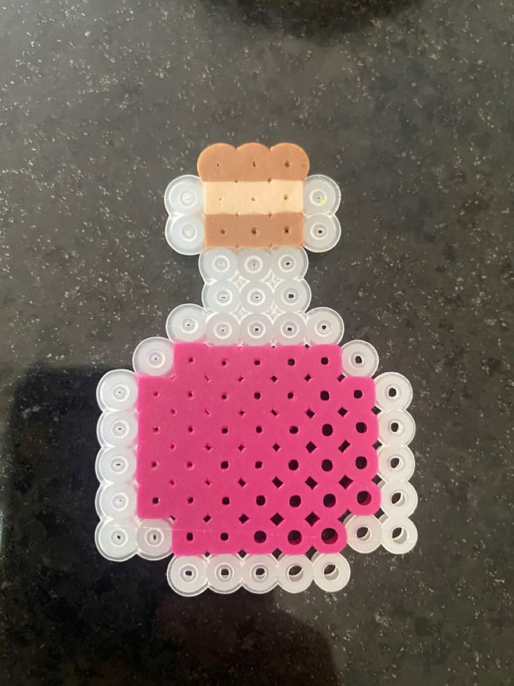 a pink and white object sitting on top of a table