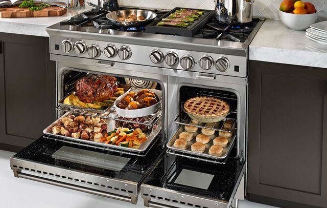 an open range in a kitchen with food on it