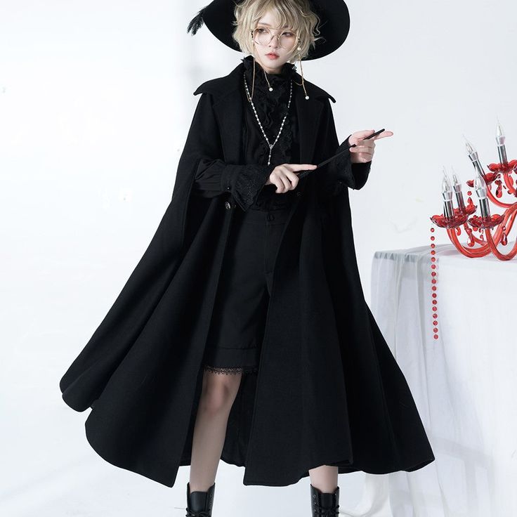 A long cloak for a prestigious black knight. Pair it with blouse and pants to create a boyish black knight outfit. Just put on a cloak to create a full atmosphere. Why not be invited into the world of knightly tales? 
 
 
 ＜Size＞ 
 
 S size 
 
 Length: 120cm 
 
 M size 
 
 Length: 124cm 
 
 L size 
 
 Length: 128cm 
 
 
 
 
 
 
 
 
 ＜Material＞ 
 
 Wool 
 Polyester 
 
 
 ＜Model worn＞ 
 
 Wearing size 
 
 S size 
 
 Model dimensions 
 
 Height: 160cm Gothic Cape Outerwear For Costume Party, Gothic Cape For Costume Party In Fall, Vampire Cape For Winter Costume Party, Vampire Style Cape For Costume Party And Winter, Vampire Style Cape For Costume Party In Winter, Vampire Cape For Costume Party In Winter, Gothic Outerwear For Fall Fantasy Events, Gothic Long Sleeve Cape For Costume, Gothic Cape Outerwear For Costumes