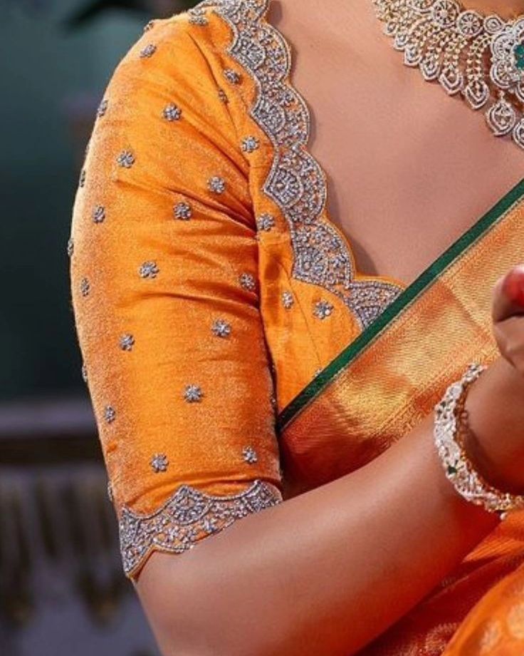 "✨ Elevate your ethnic look with our stunning Orange Stones Maggam Work Blouse! Handcrafted to perfection, this masterpiece combines tradition with modern elegance. Available at ₹2100 unstitched and ₹2750 stitched, it's designed to make you stand out at any event. Custom colors and sizes available to fit your unique style. 📦 Fast Dispatch in 4 Days 📞 Reach us at 96404 90158 to book yours today! #OrangeElegance #MaggamMagic #HandcraftedPerfection #EthnicWear #TraditionalFashion #CustomMadeBl... Orange Blouse Maggam Work Designs, Stone Work Blouse, Blouse Works, Maggam Work Blouse, Simple Embroidery Designs, Ladies Blouse Designs, Hand Work Blouse, Maggam Work Blouses, Ladies Blouse