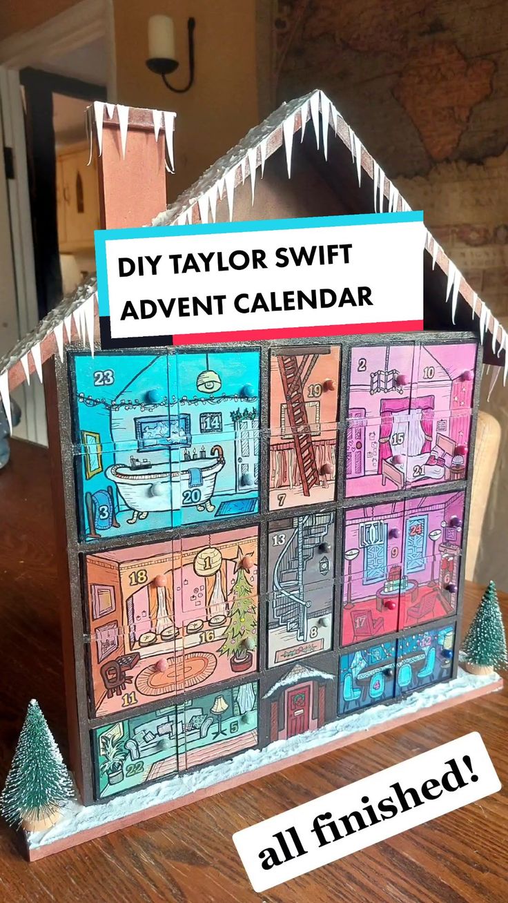 a paper house with the words diy taylor swift advent calendar written on it's side