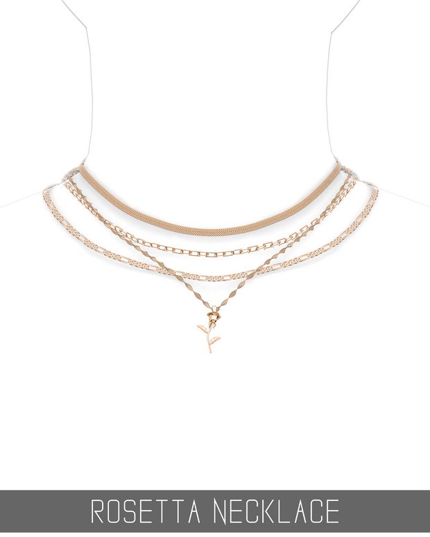 the rosetta necklace is shown with an anchor and cross charm on it's chain