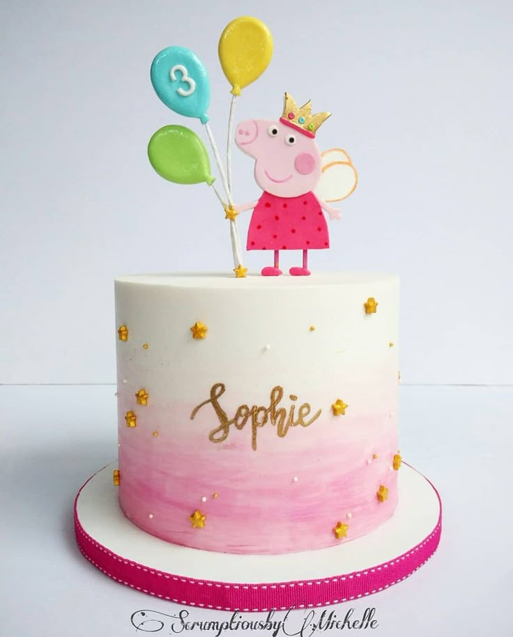 a peppo pig birthday cake with balloons on top