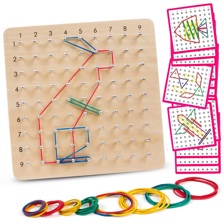 a wooden board with different colored rings and numbers on it next to matching game pieces