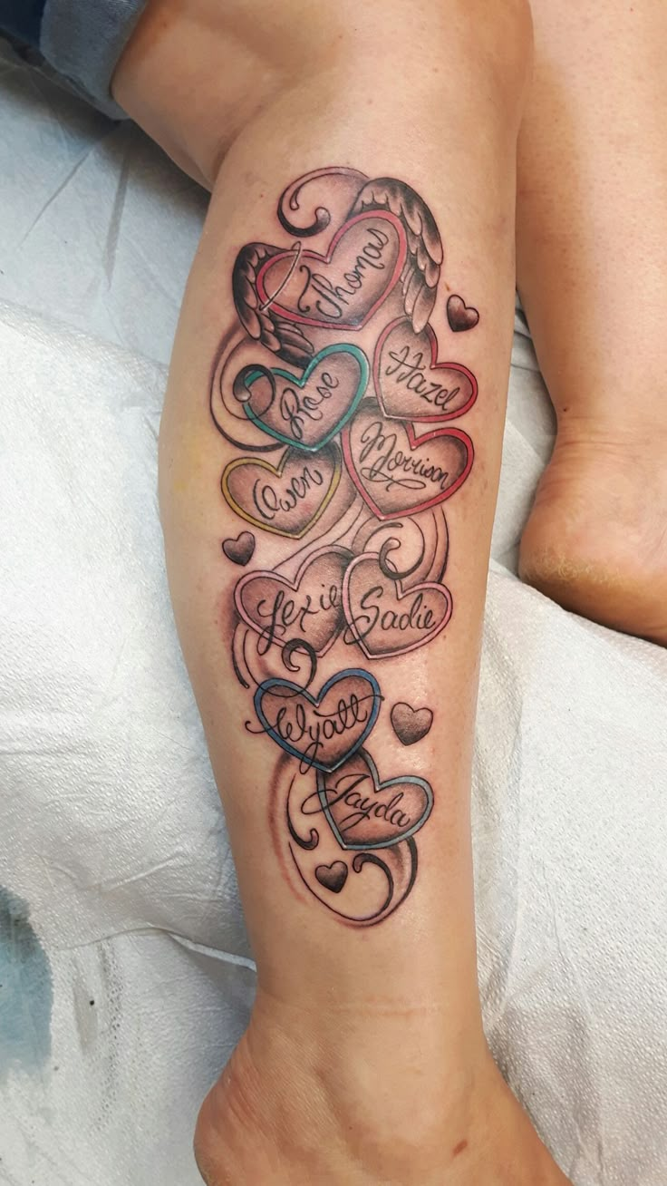 a woman's leg with hearts and words on it