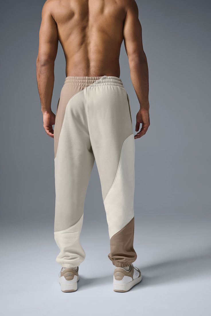 Bring some swagger to your recovery, chill, and lounge fits with sweats that stand out. Made with the same smooth outside, fleecy inside French terry fabric as our Accolade sweatpant, finished with an elastic waistband and cuffs, and done in a relaxed fit that reads laid-back but not slouchy. Double down on the striking stitched wave pattern by pairing yours with the matching hoodie. Fits With Sweats, Beige Athleisure Bottoms For Sports, Sporty Beige Sweatpants For Loungewear, Beige Relaxed Fit Athleisure Bottoms, Beige Athleisure Bottoms For Loungewear, Beige Athleisure Bottoms For Lounging, Alo Yoga Relaxed Fit Sports Bottoms, Beige Sweatpants With Pockets For Lounging, Sporty Cream Pants For Loungewear