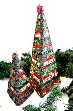 two christmas trees made out of wrapping paper